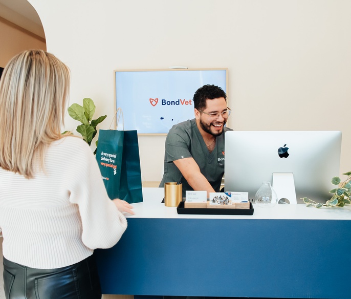 Vet with pet parent in lobby