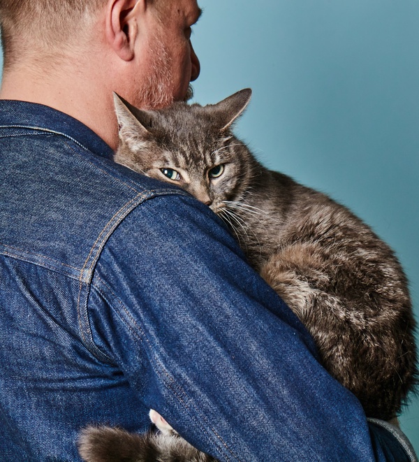 Man holding his pet cat