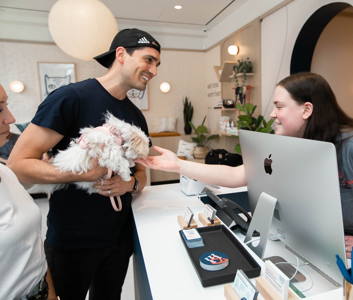 Pet in lobby with care coordinator
